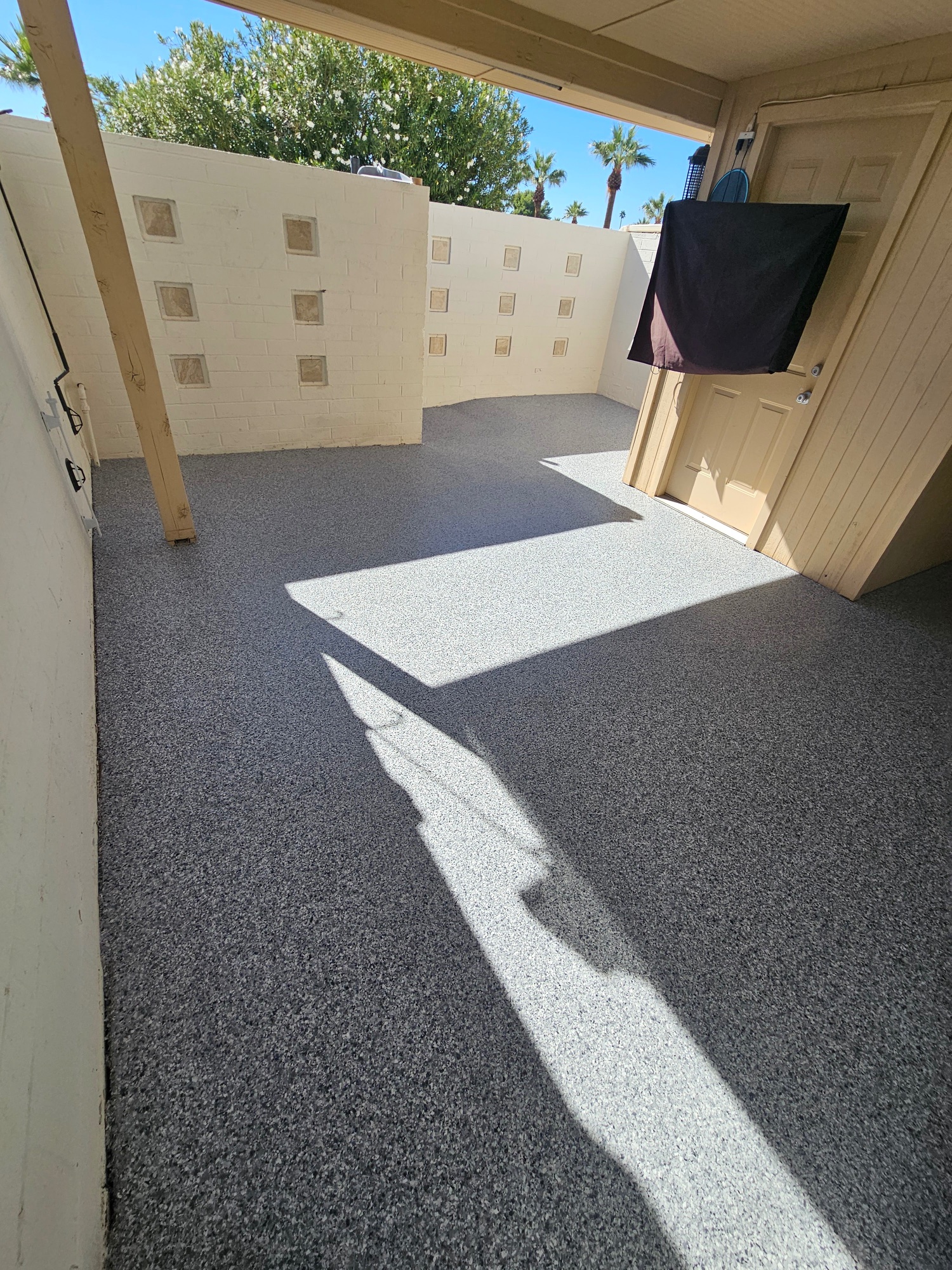 Epoxy flake covered patio with palm trees Phoenix