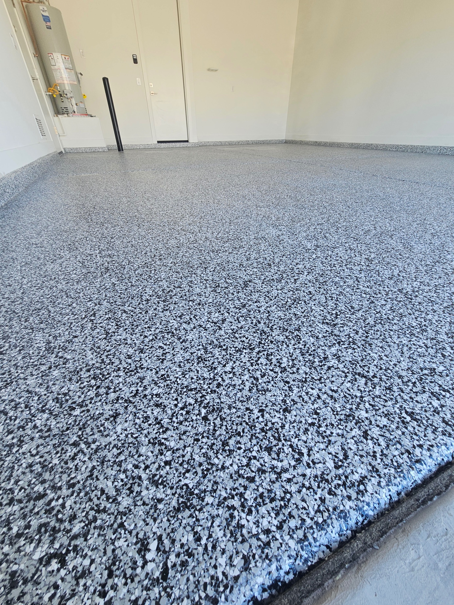 Black white epoxy flake garage floor closeup Phoenix