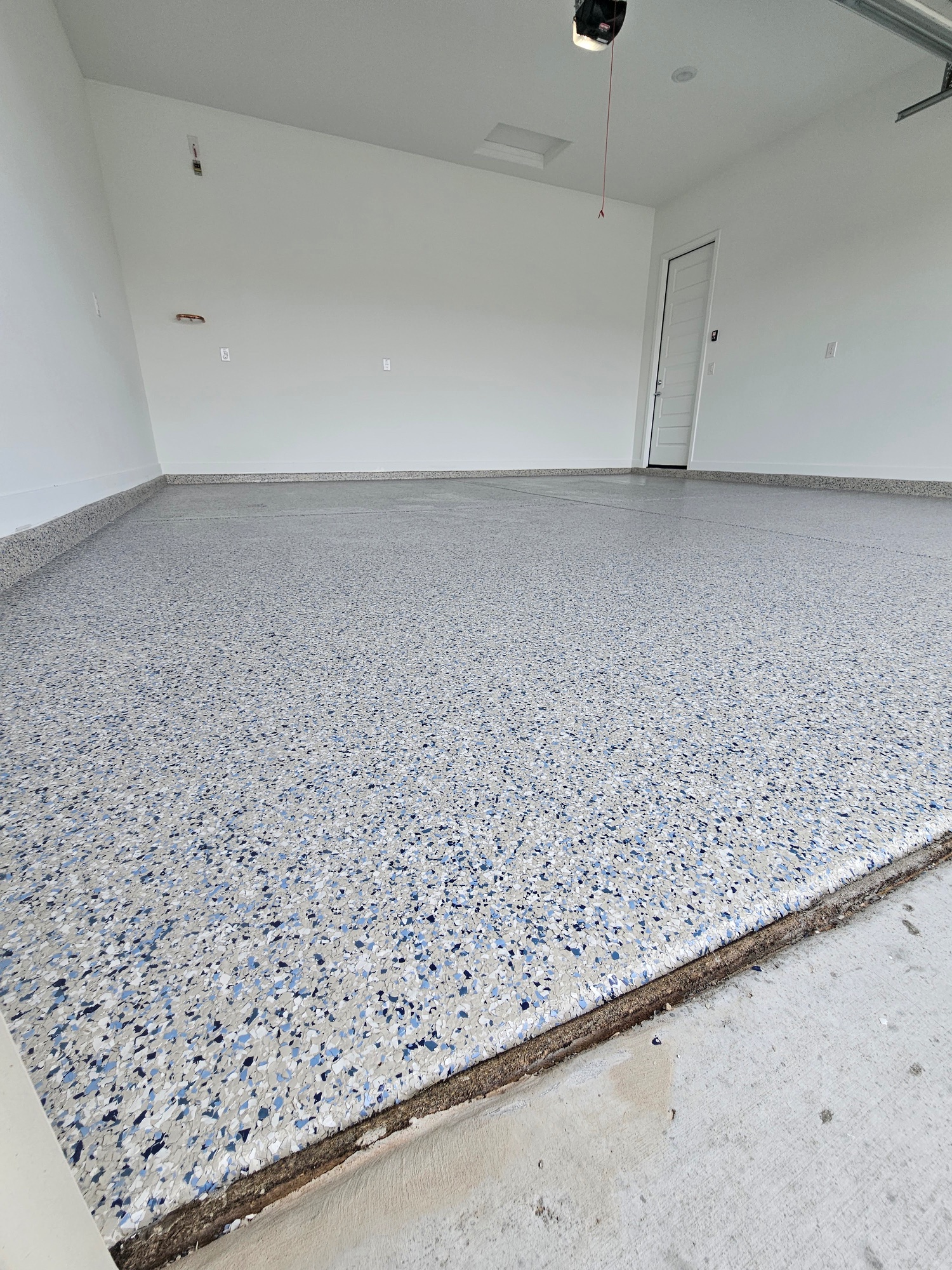 Blue white flake epoxy garage floor new construction Arizona