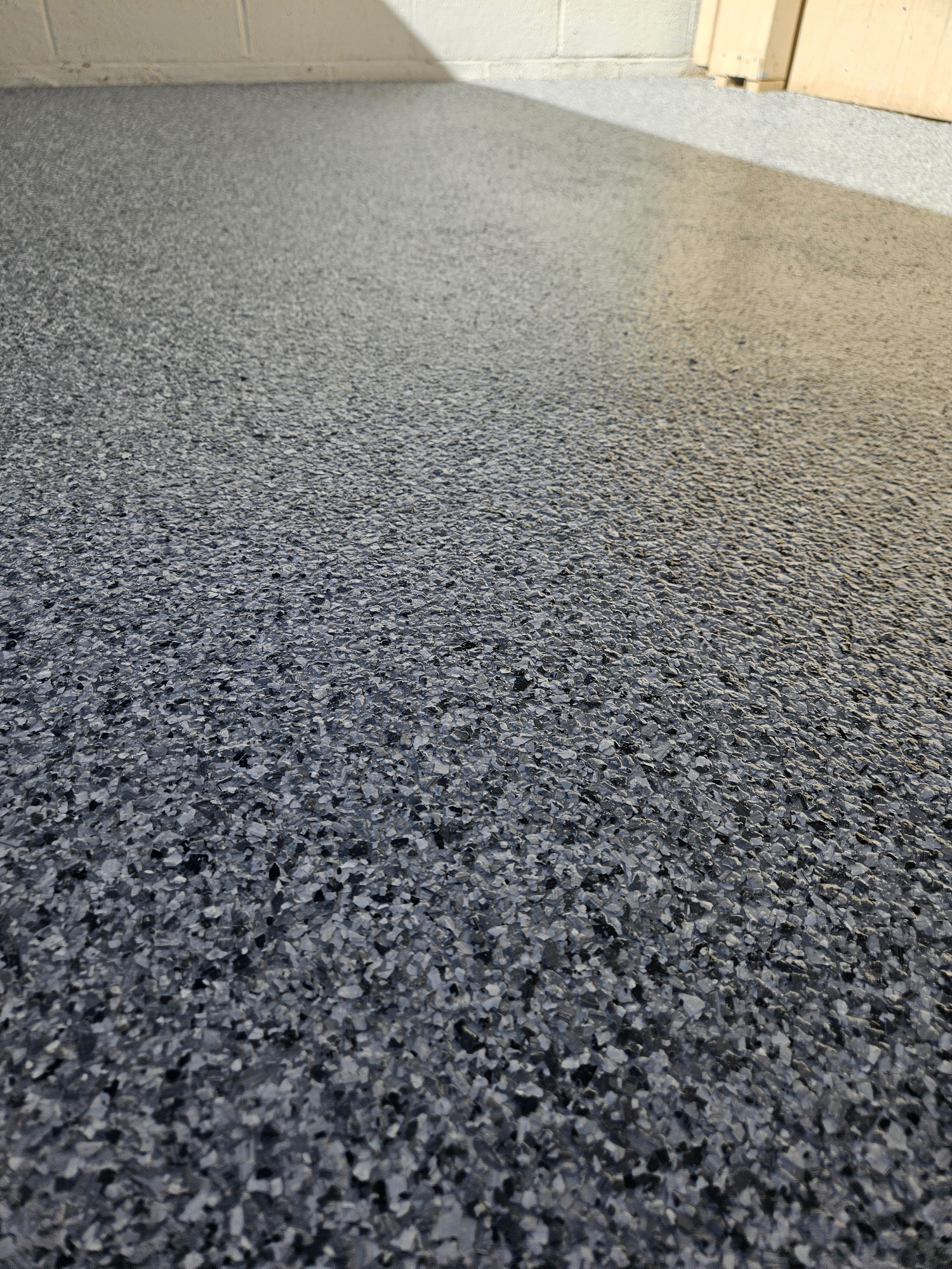 Dark charcoal flake epoxy floor closeup Arizona