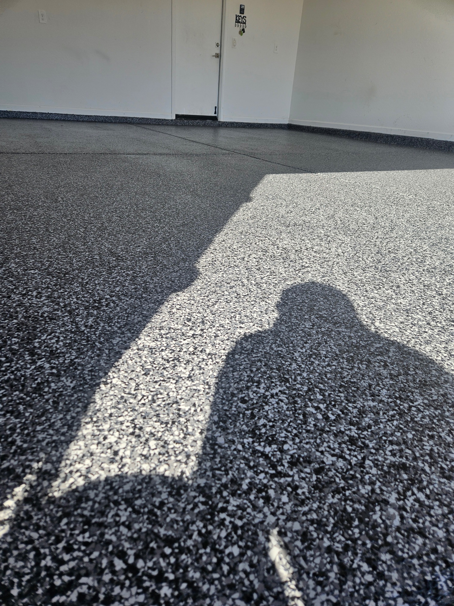 Dark grey flake epoxy garage floor sunlight Arizona