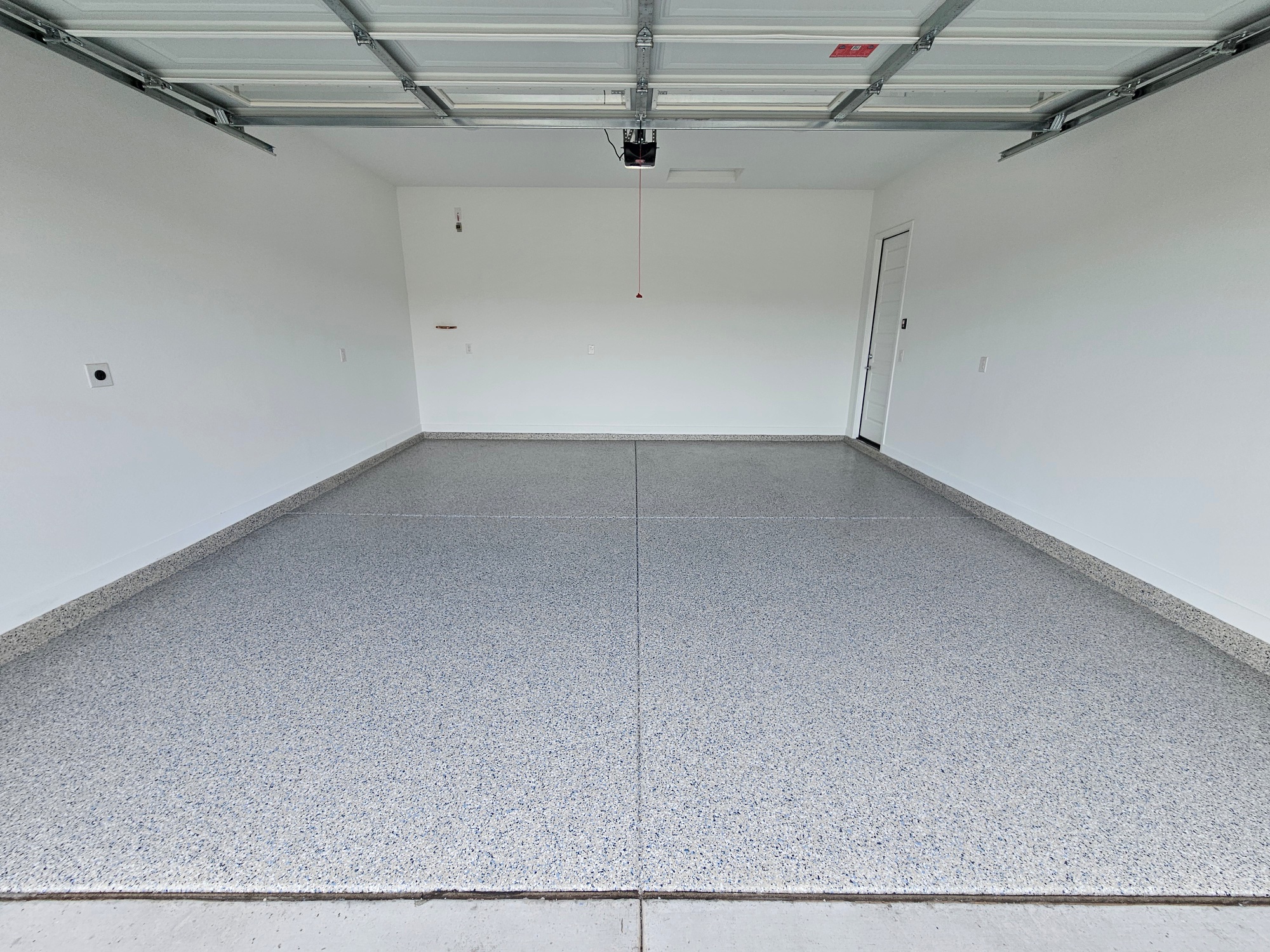 Light grey blue flake epoxy garage floor wide angle Phoenix