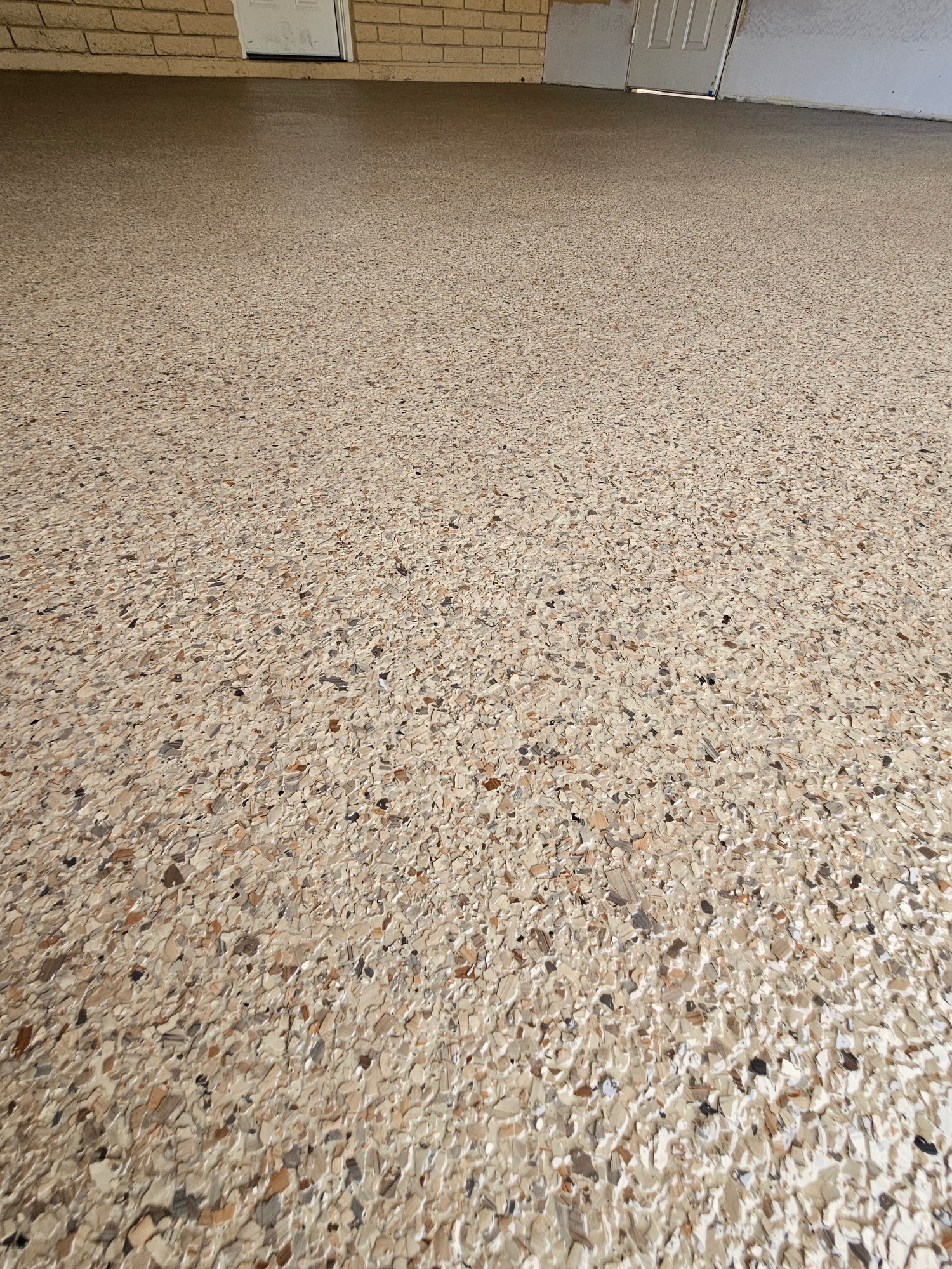 Tan cream flake epoxy garage floor closeup Phoenix
